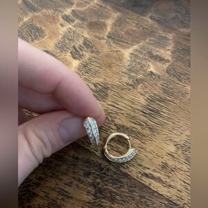 Little gold hoops with studs.